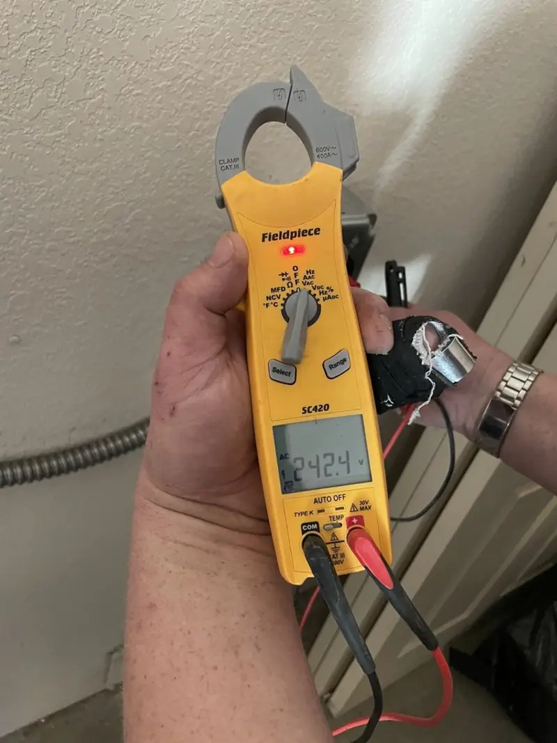 Voltage testing with clamp meter during Electrical Installation Services in Dallas